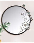 Ronde spiegel diameter 65 centimeter met moderne decoratie en zwarte rand